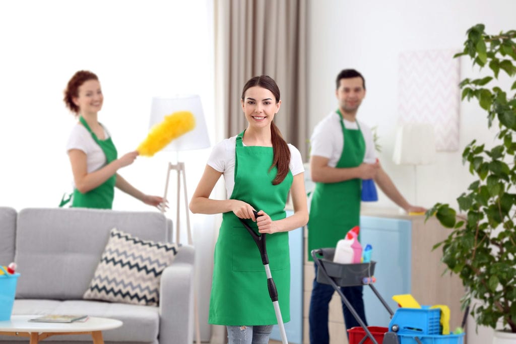 A Commercial and Residential Cleaning Service team working in living room in Milwaukee, WI